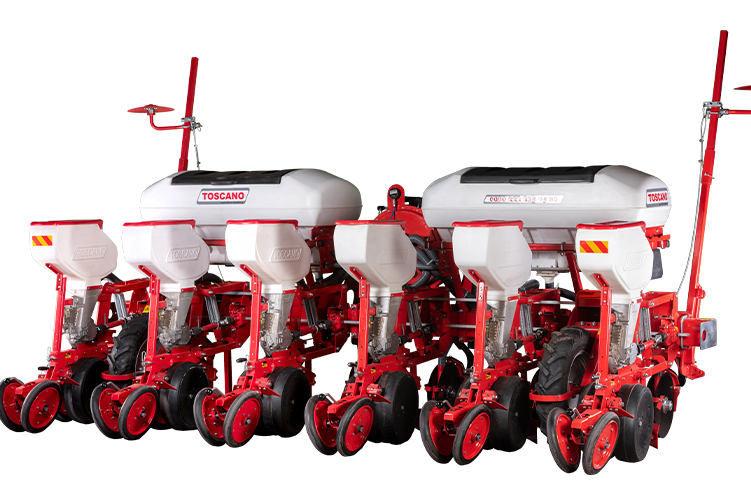 Semoir de précision rouge Toscano sur fond blanc, conçu pour une implantation régulière sur sol préparé.